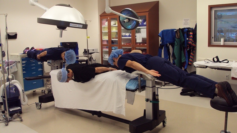 Doctors planking on an operating table