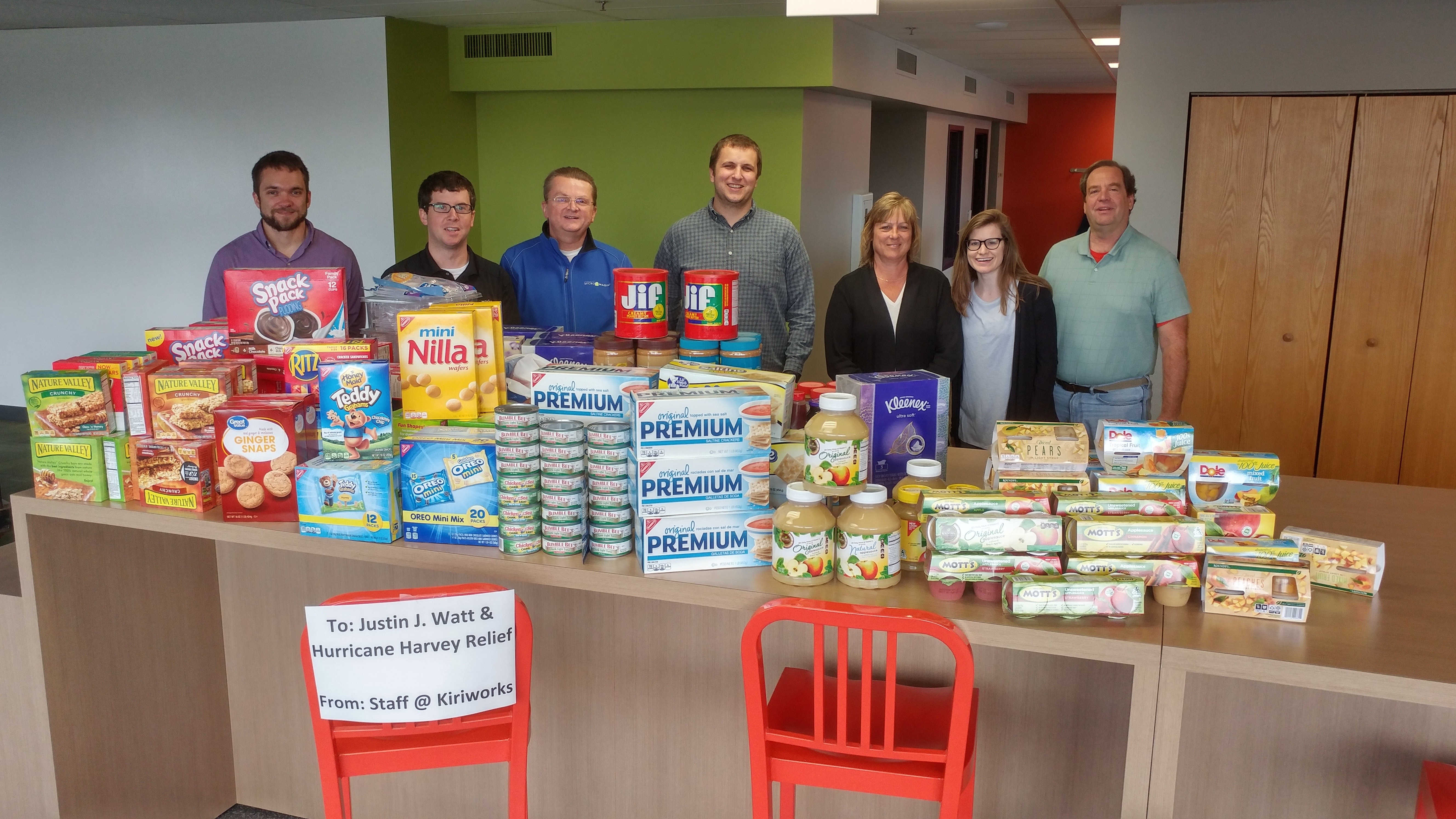 Kiriworks team members with food they donated to hurricane Harvey relief