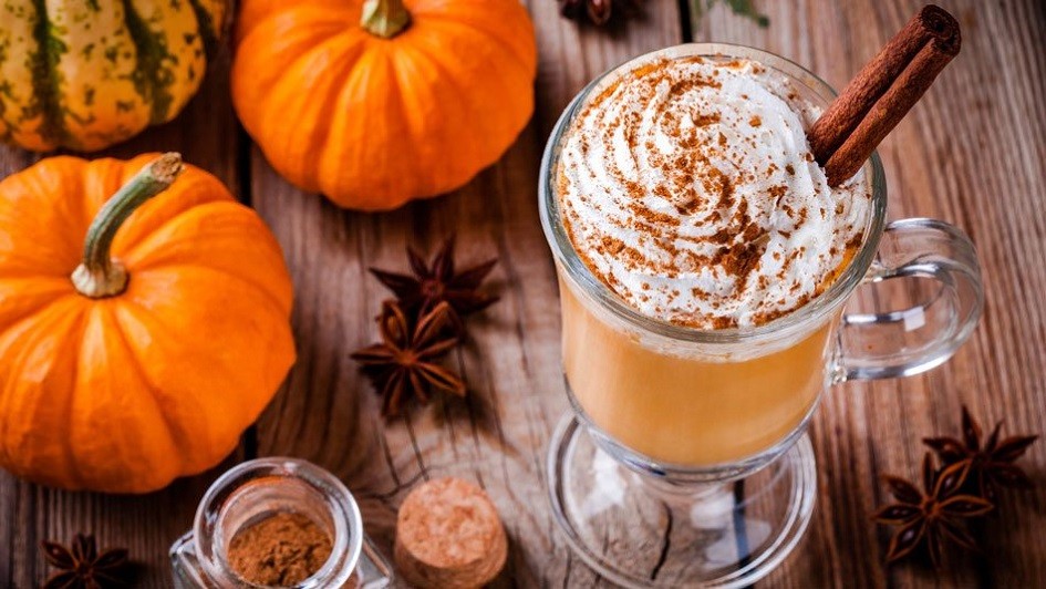 Pumpkin spice latte and small pumpkins